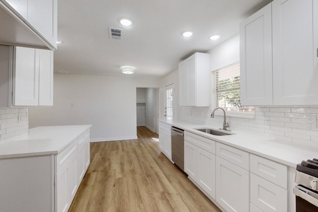 unfurnished living room with ceiling fan and light hardwood / wood-style flooring