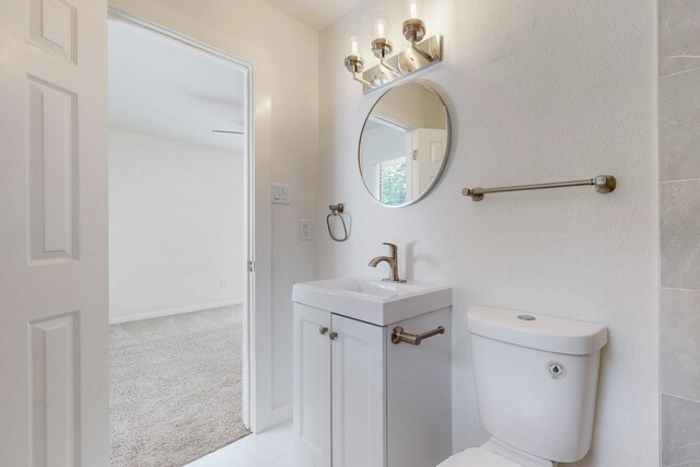 unfurnished room with light colored carpet and ceiling fan