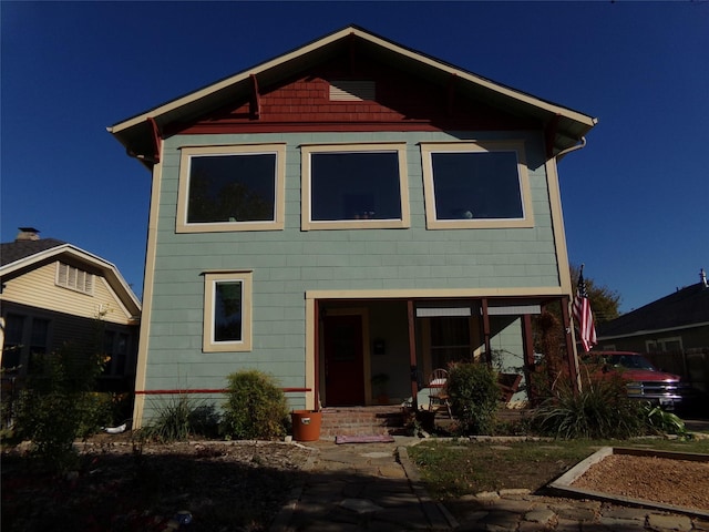 back of house with covered porch