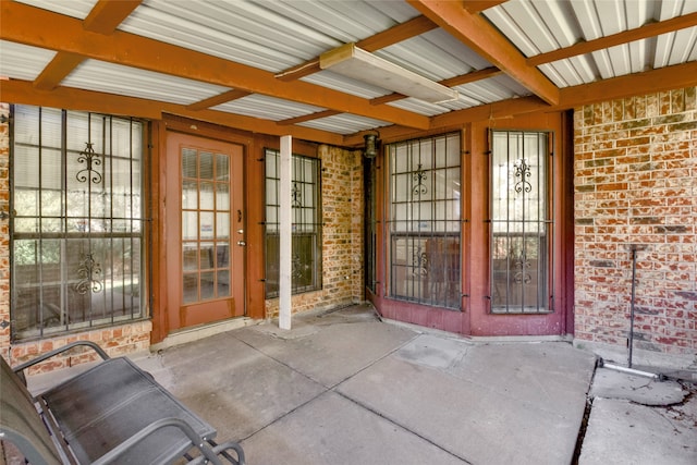 property entrance with a patio