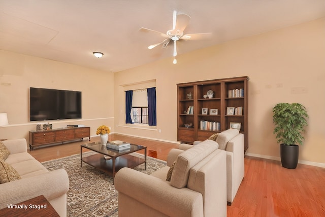 living room with ceiling fan and light wood-type flooring