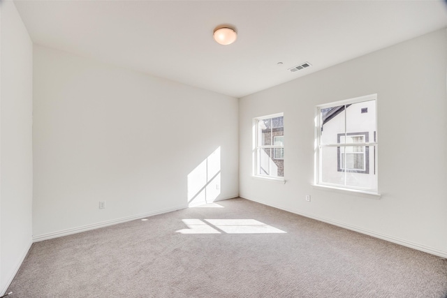 empty room with light colored carpet