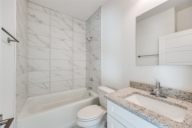 full bathroom featuring vanity, toilet, and tiled shower / bath combo