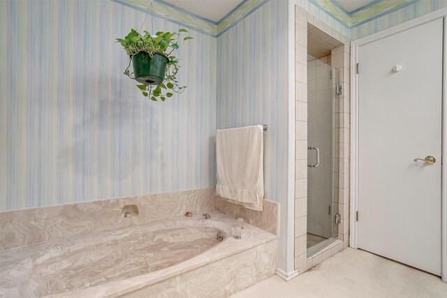 bathroom featuring ornamental molding, a textured ceiling, and independent shower and bath