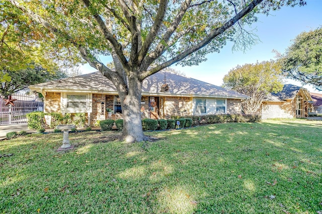 ranch-style house featuring a front lawn