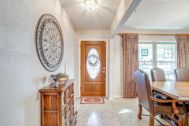 foyer with a textured ceiling