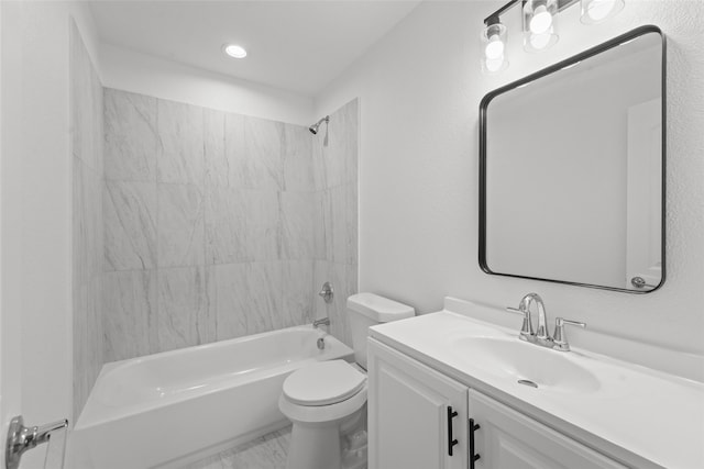 full bathroom featuring vanity, toilet, and tiled shower / bath