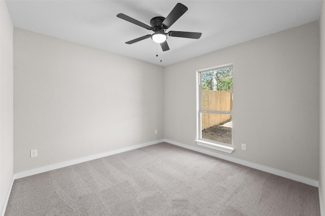 906 Benton St, Bonham, TX 75418 - unfurnished room with carpet, baseboards, and a ceiling fan