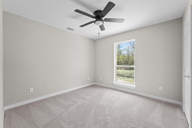 906 Benton St, Bonham, TX 75418 - empty room with carpet flooring, baseboards, and a ceiling fan