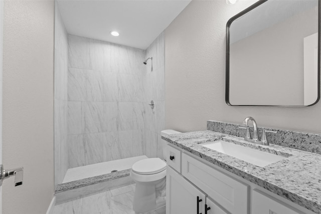 906 Benton St, Bonham, TX 75418 - full bathroom featuring marble look tiles, vanity, toilet, tiled shower, and recessed lighting