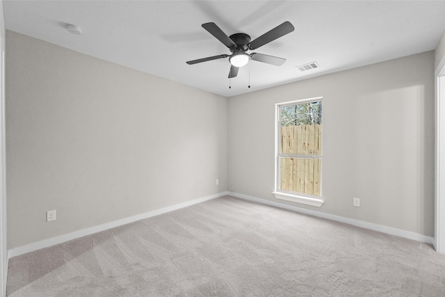 carpeted empty room with ceiling fan