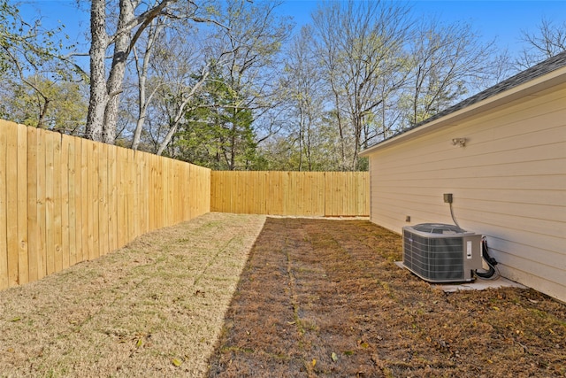 view of yard featuring central air condition unit