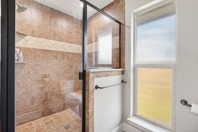 bathroom with walk in shower and plenty of natural light