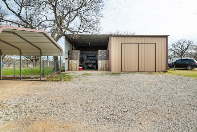 view of outbuilding with a carport