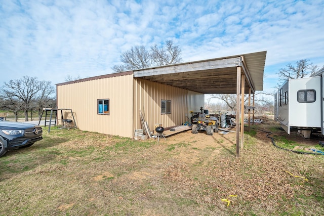 view of outbuilding featuring a carport