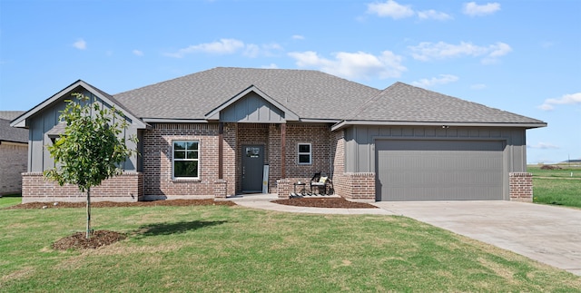 view of front of house featuring a garage and a front lawn