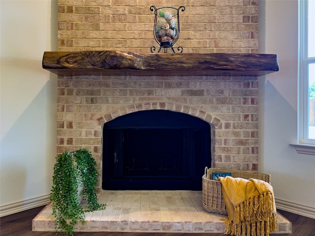 room details featuring a fireplace and hardwood / wood-style floors