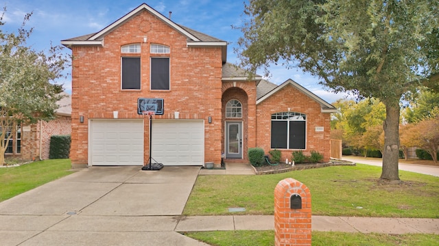 view of front property with a garage and a front lawn