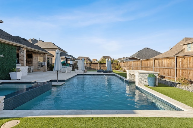 view of pool featuring an in ground hot tub and a patio