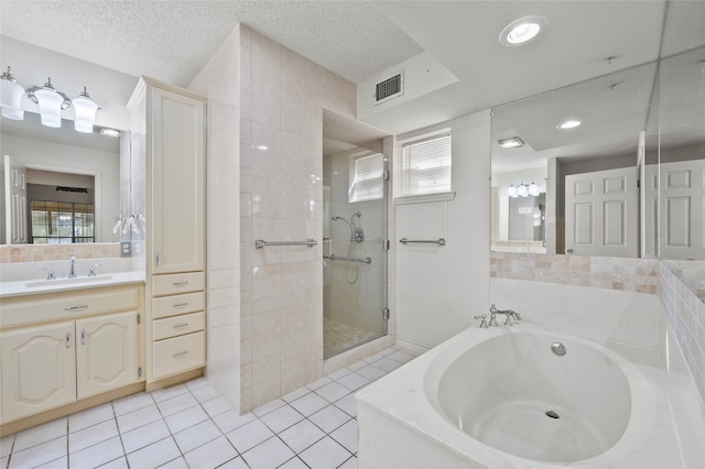 bathroom with tile patterned flooring, vanity, separate shower and tub, and a wealth of natural light