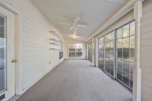 unfurnished sunroom with ceiling fan and lofted ceiling