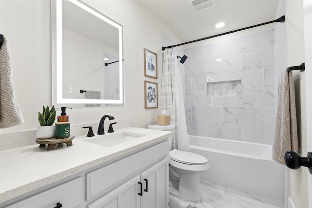 full bathroom with vanity, shower / bath combo, and toilet