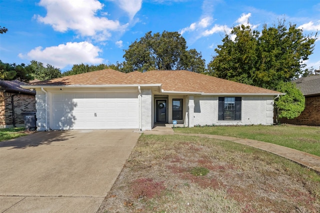 single story home featuring a front yard and a garage