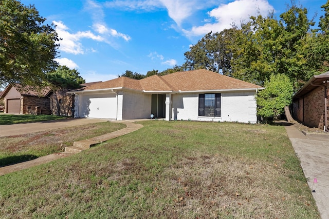 ranch-style house with a garage and a front yard