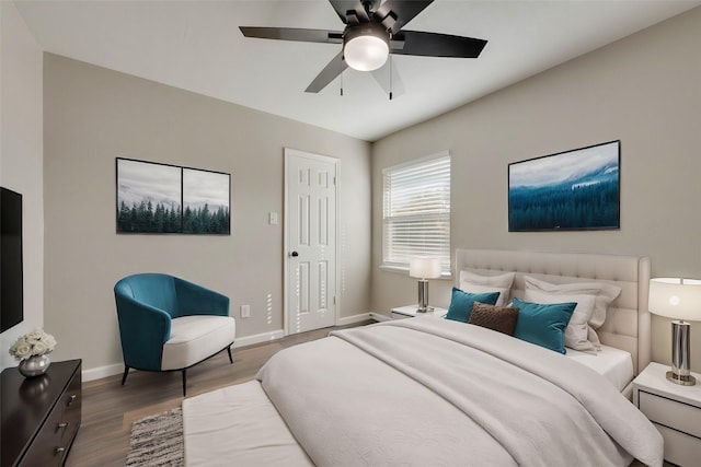 bedroom featuring ceiling fan and dark hardwood / wood-style flooring