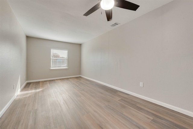 spare room with ceiling fan and light hardwood / wood-style flooring