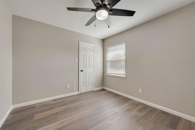 empty room featuring hardwood / wood-style flooring and ceiling fan