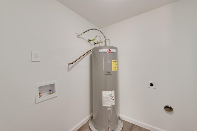 utility room featuring water heater