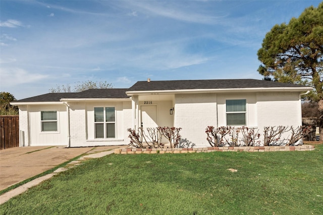 back of house featuring a lawn