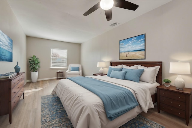 bedroom with light wood-type flooring and ceiling fan