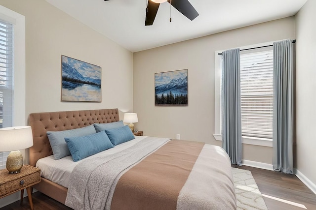 bedroom featuring ceiling fan and dark hardwood / wood-style floors