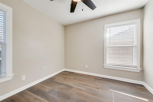 unfurnished room with hardwood / wood-style floors and ceiling fan