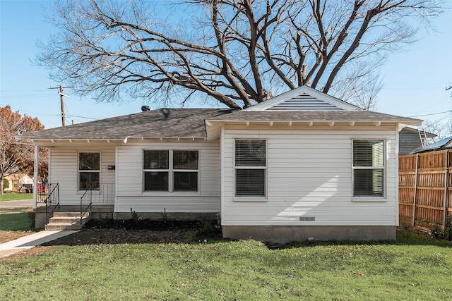 back of property featuring a yard