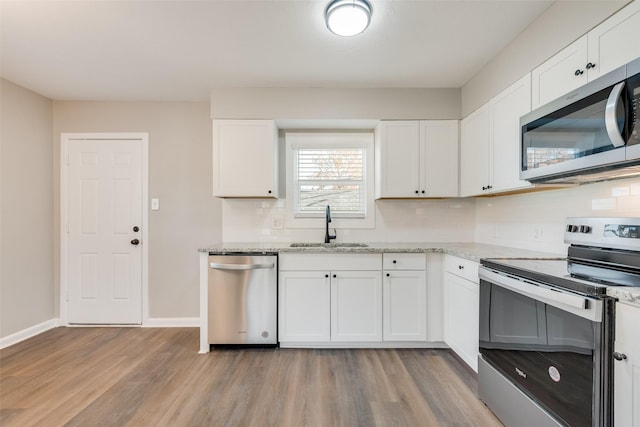 kitchen with white cabinets, sink, and stainless steel appliances