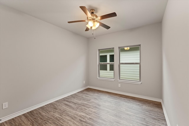 spare room with ceiling fan and light hardwood / wood-style floors