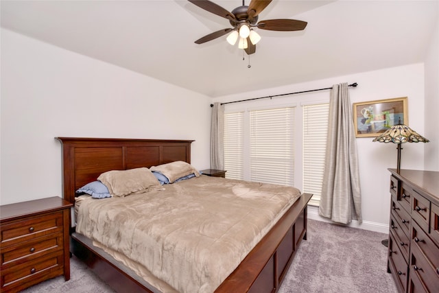 bedroom featuring light colored carpet and ceiling fan