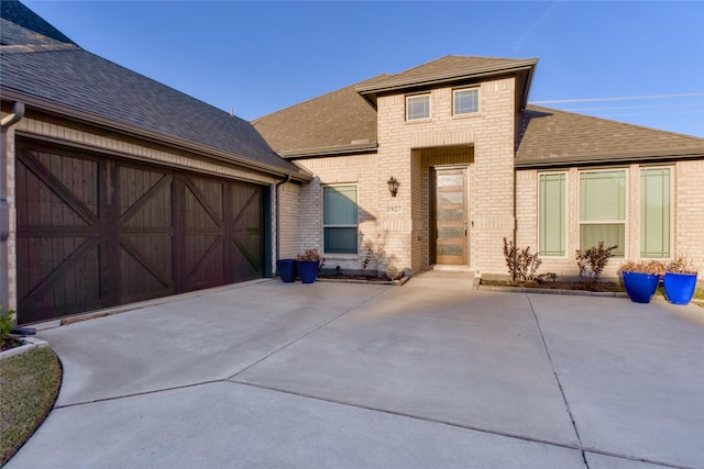 1927 Frediano Ln, Mclendon Chisholm, TX 75032 - view of front of house with a shingled roof, an attached garage, and brick siding