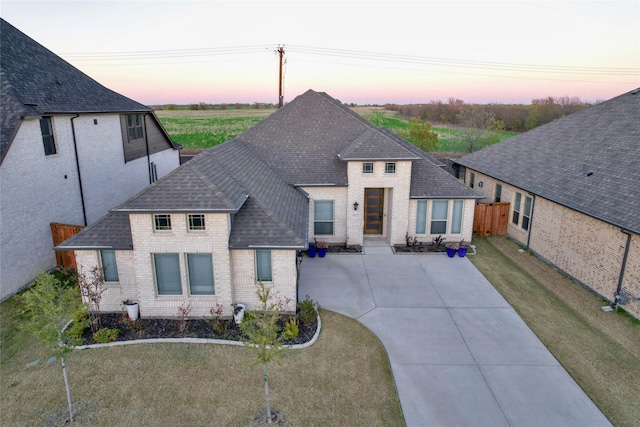 1927 Frediano Ln, Mclendon Chisholm, TX 75032 - view of front of property featuring brick siding, a shingled roof, and driveway
