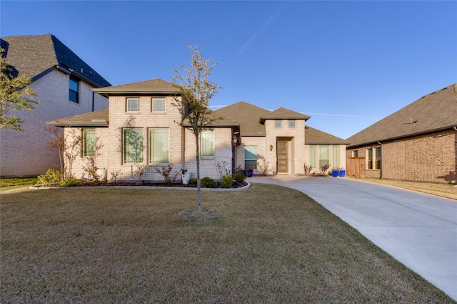 1927 Frediano Ln, Mclendon Chisholm, TX 75032 - view of front of home featuring brick siding, driveway, a front lawn, and roof with shingles