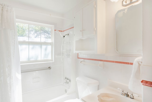 full bathroom featuring tile walls, vanity, toilet, and shower / tub combo with curtain