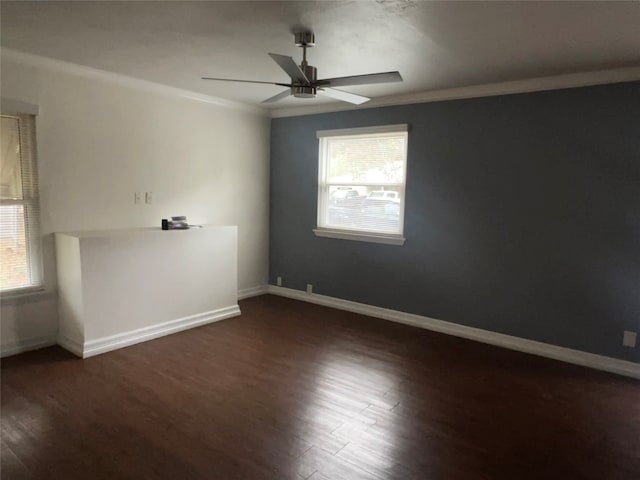 empty room featuring dark hardwood / wood-style floors, ceiling fan, and crown molding