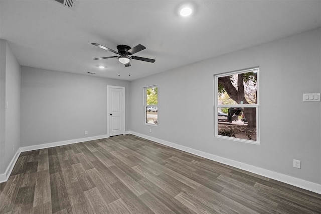 empty room featuring hardwood / wood-style flooring and ceiling fan