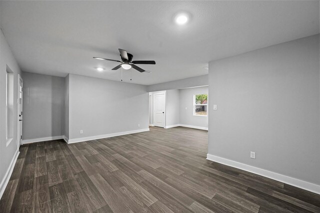 empty room featuring ceiling fan and dark hardwood / wood-style floors