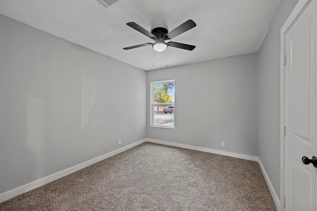 spare room with carpet and ceiling fan