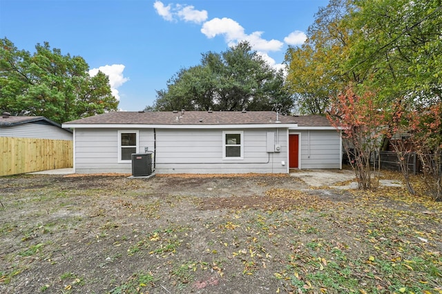 back of property with central AC unit