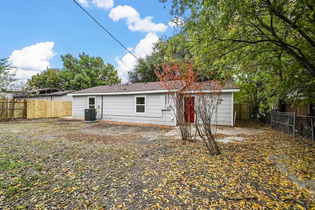 back of property featuring central air condition unit